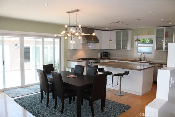 Dining room, Interior, Kitchen, Pendant Lights, Recessed Lighting, Stainless Steel Appliances, Wood Texture Flooring