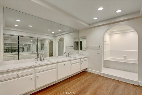 Bathroom, Dual Sink Vanities, Interior, Recessed Lighting, Wood Texture Flooring