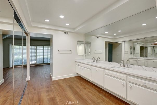 Bathroom, Dual Sink Vanities, Interior, Recessed Lighting, Wood Texture Flooring