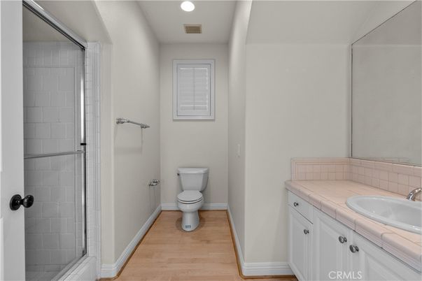 Bathroom, Interior, Recessed Lighting, Tile Countertops, Wood Texture Flooring