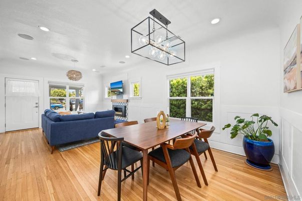 Dining room, Fireplace, Interior, Living room, Pendant Lights, Recessed Lighting, Wood Texture Flooring