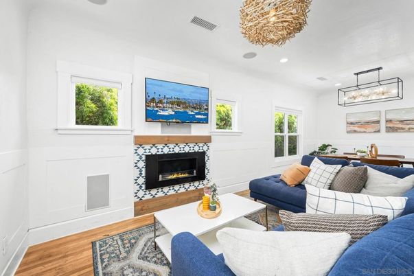 Dining room, Fireplace, Interior, Living room, Pendant Lights, Recessed Lighting, Wood Texture Flooring