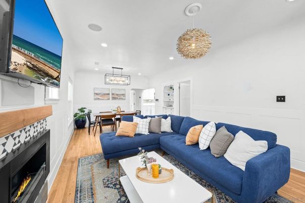 Chandelier, Dining room, Fireplace, Interior, Living room, Pendant Lights, Recessed Lighting, Wood Texture Flooring
