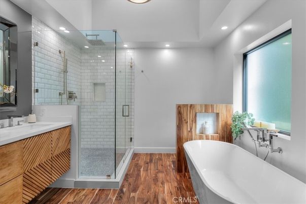 Bathroom, Dual Sink Vanities, Free Standing Baths, Glass Shower, Interior, Recessed Lighting, Wood Texture Flooring