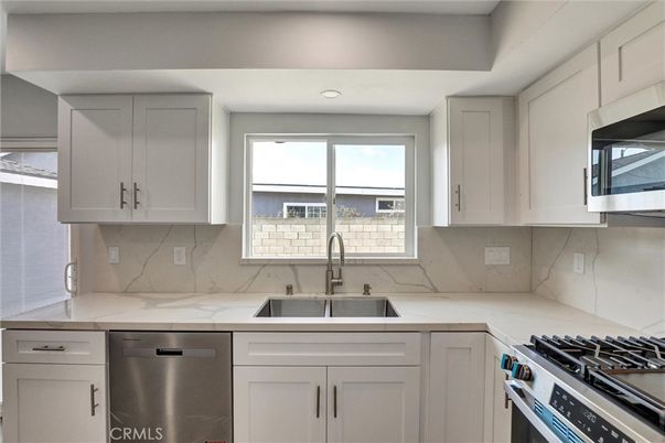 Interior, Kitchen, Marble Walls, Recessed Lighting, Stainless Steel Appliances