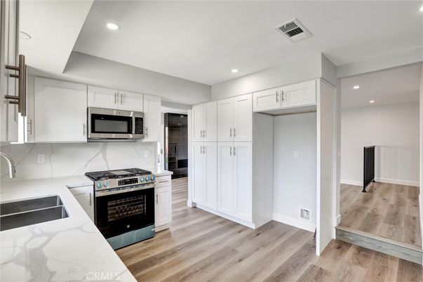 Interior, Kitchen, Recessed Lighting, Stainless Steel Appliances, Wood Texture Flooring