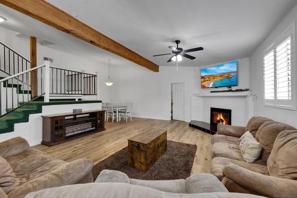 Dining room, Fireplace, Interior, Living room, Pendant Lights, Wooden Beams, Wood Texture Flooring