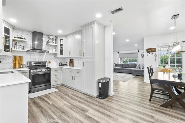 Dining room, Interior, Kitchen, Living room, Pendant Lights, Recessed Lighting, Stainless Steel Appliances, Wood Texture Flooring