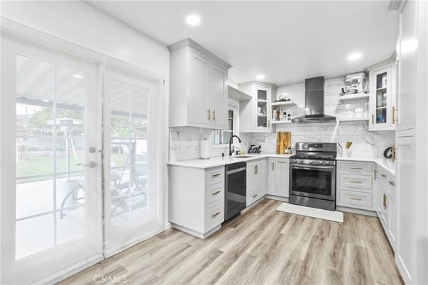 Interior, Kitchen, Marble Walls, Recessed Lighting, Stainless Steel Appliances, Wood Texture Flooring