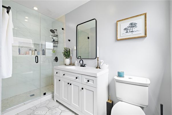Bathroom, Dual Sink Vanities, Glass Shower, Interior, Marble, Marble Walls, Recessed Lighting