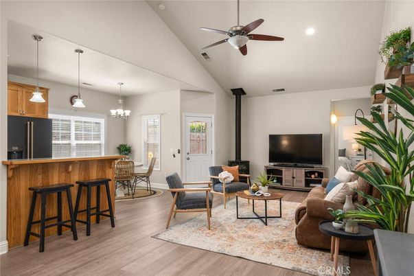 Chandelier, Dining room, Fireplace, Interior, Living room, Pendant Lights, Recessed Lighting, Wood Texture Flooring