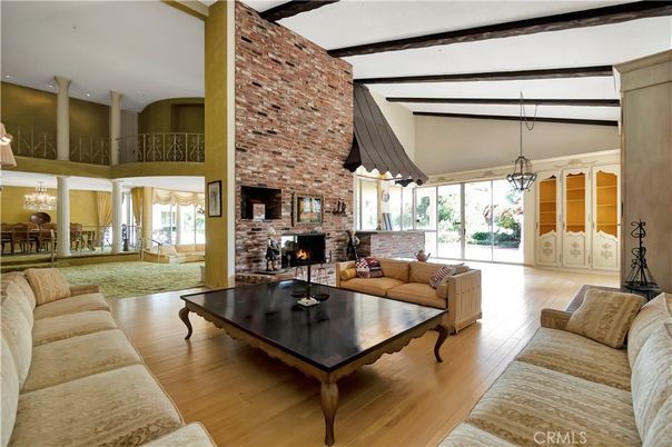 Chandelier, Dining room, Fireplace, Interior, Living room, Pendant Lights, Stone Walls, Wood Texture Flooring