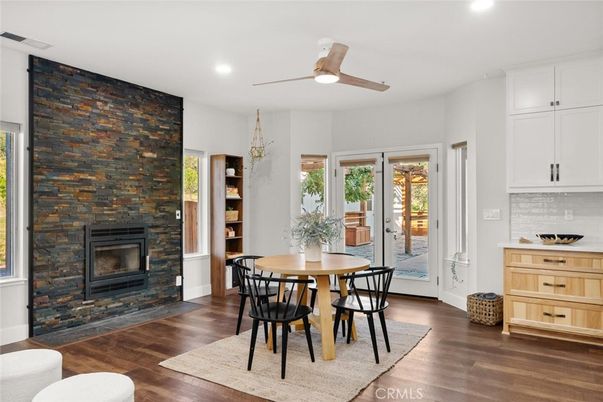 Dining room, Fireplace, Interior, Recessed Lighting, Stone Walls, Wood Texture Flooring