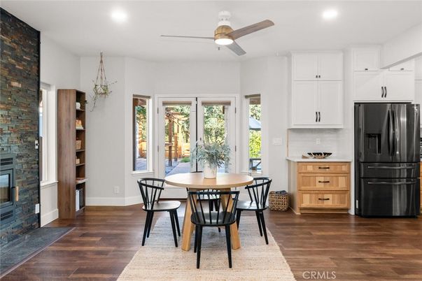 Dining room, Fireplace, Interior, Kitchen, Recessed Lighting, Stone Walls, Wood Texture Flooring