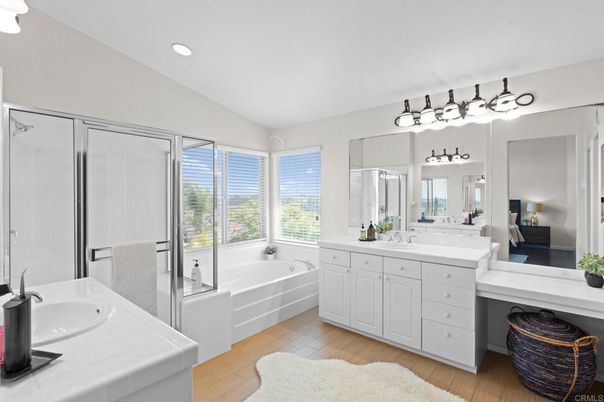 Bathroom, Dual Sink Vanities, Glass Shower, Interior, Recessed Lighting, Tile Countertops, Wood Texture Flooring