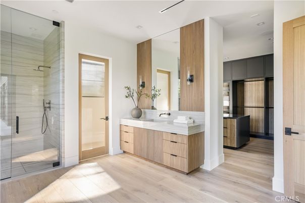 Bathroom, Dual Sink Vanities, Glass Shower, Interior, Recessed Lighting, Wood Texture Flooring