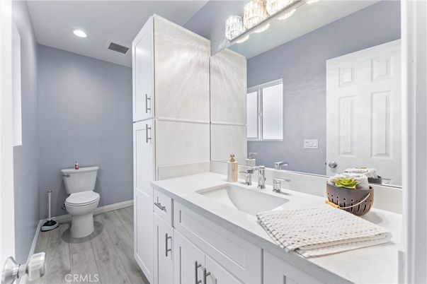 Bathroom, Dual Sink Vanities, Interior, Recessed Lighting, Wood Texture Flooring