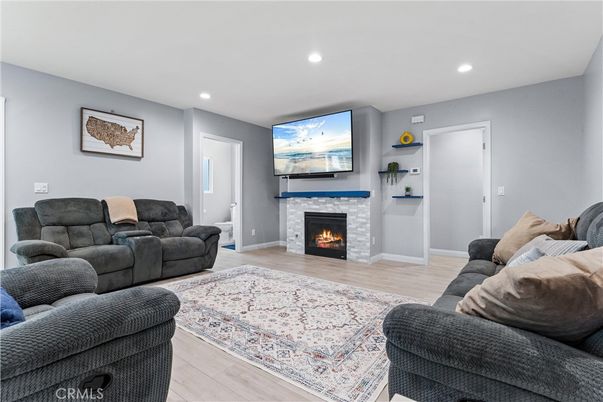 Fireplace, Interior, Living room, Recessed Lighting, Wood Texture Flooring