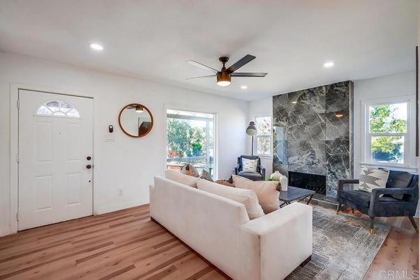 Fireplace, Interior, Living room, Marble Walls, Recessed Lighting, Wood Texture Flooring