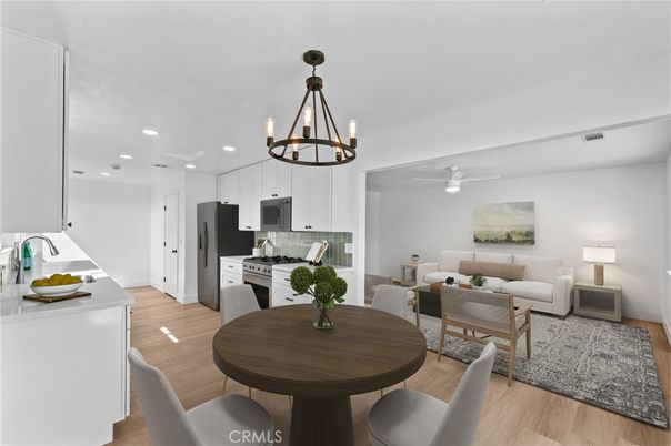 Chandelier, Dining room, Interior, Kitchen, Living room, Pendant Lights, Recessed Lighting, Stainless Steel Appliances, Wood Texture Flooring