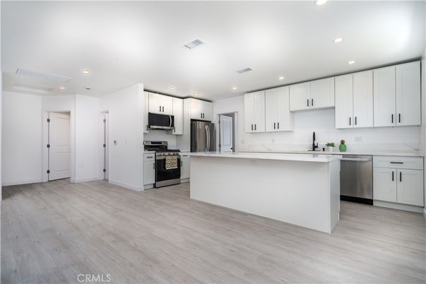 Interior, Kitchen, Recessed Lighting, Stainless Steel Appliances, Wood Texture Flooring