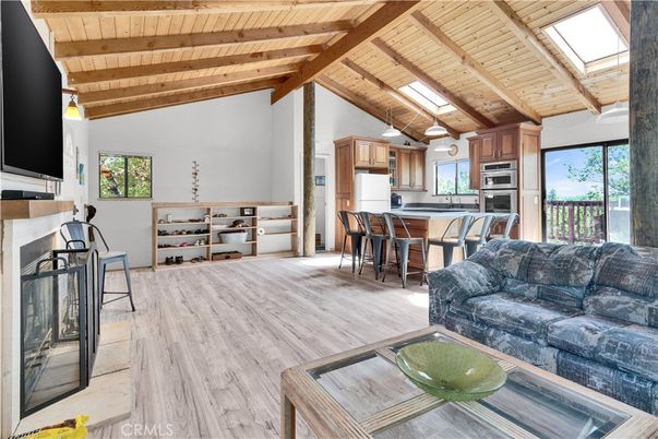 Dining room, Fireplace, Interior, Kitchen, Living room, Pendant Lights, Stainless Steel Appliances, Wooden Beams, Wooden Ceilings, Wood Texture Flooring
