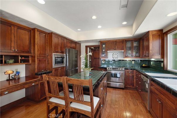 Interior, Kitchen, Recessed Lighting, Stainless Steel Appliances, Tile Countertops, Wood Texture Flooring