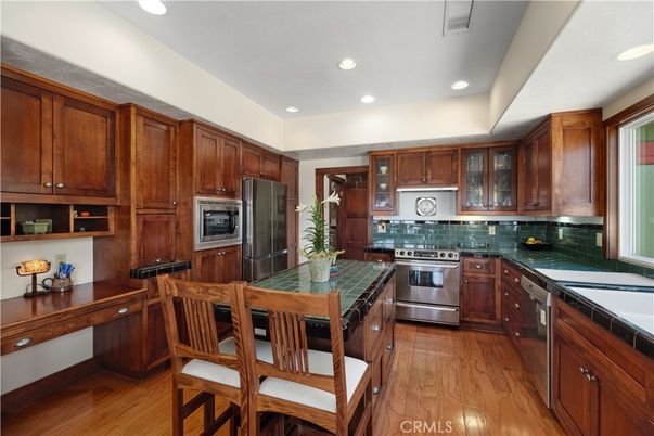 Interior, Kitchen, Recessed Lighting, Stainless Steel Appliances, Tile Countertops, Wood Texture Flooring