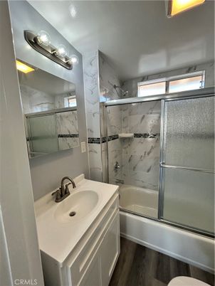 Bathroom, Glass Shower, Interior, Marble Walls, Wood Texture Flooring