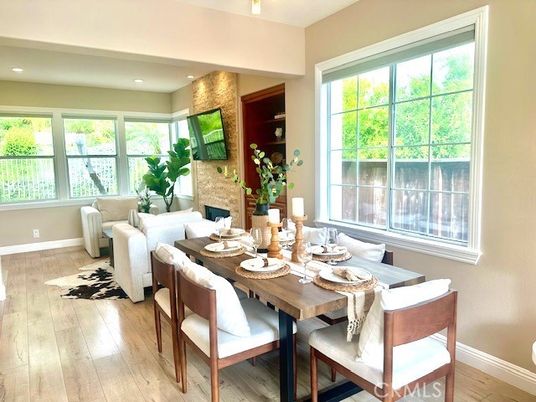 Dining room, Fireplace, Interior, Living room, Recessed Lighting, Wood Texture Flooring