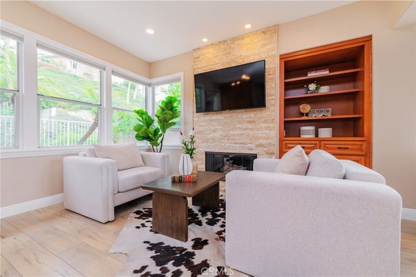 Fireplace, Interior, Living room, Recessed Lighting, Stone Walls, Wood Texture Flooring