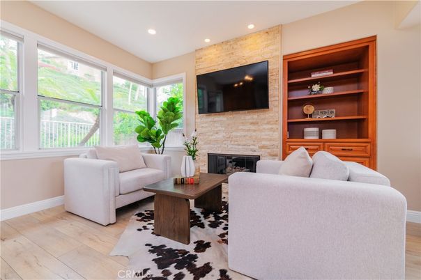 Fireplace, Interior, Living room, Recessed Lighting, Stone Walls, Wood Texture Flooring
