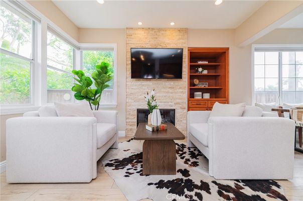 Fireplace, Interior, Living room, Recessed Lighting, Stone Walls, Wood Texture Flooring