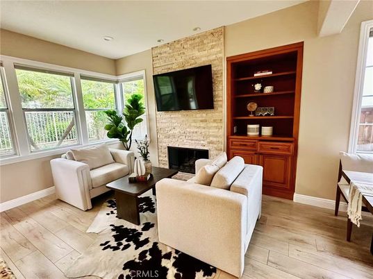 Fireplace, Interior, Living room, Recessed Lighting, Stone Walls, Wood Texture Flooring