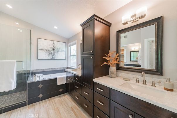 Bathroom, Dual Sink Vanities, Glass Shower, Interior, Recessed Lighting, Wood Texture Flooring