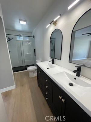 Bathroom, Dual Sink Vanities, Glass Shower, Interior, Recessed Lighting, Wood Texture Flooring