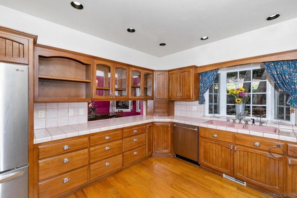 Interior, Kitchen, Recessed Lighting, Stainless Steel Appliances, Tile Countertops, Wood Texture Flooring