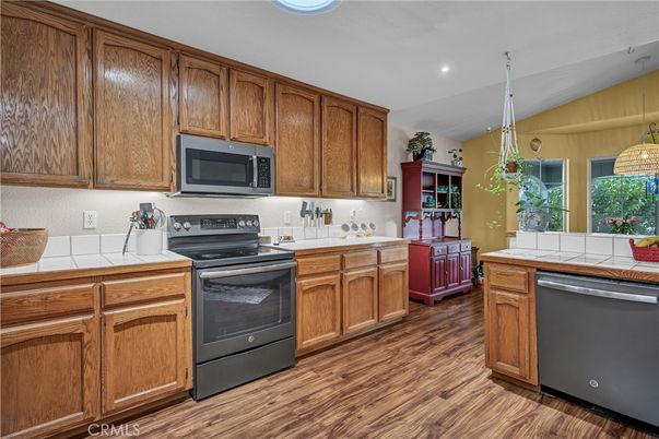Interior, Kitchen, Pendant Lights, Recessed Lighting, Tile Countertops, Wood Texture Flooring