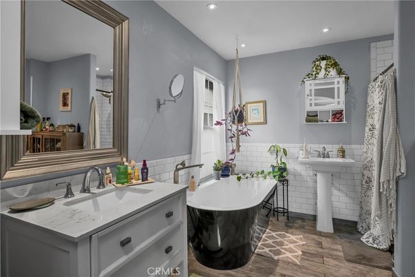 Bathroom, Dual Sink Vanities, Free Standing Baths, Interior, Recessed Lighting, Wood Texture Flooring