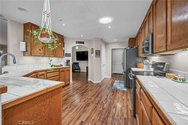 Interior, Kitchen, Pendant Lights, Recessed Lighting, Tile Countertops, Wood Texture Flooring