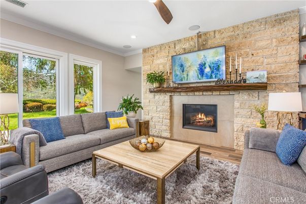 Fireplace, Interior, Living room, Recessed Lighting, Stone Walls, Wood Texture Flooring