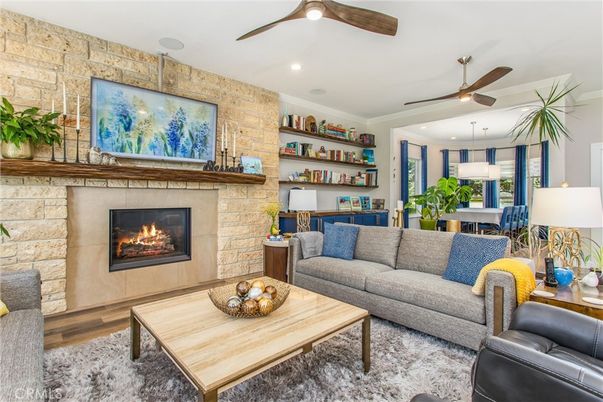 Dining room, Fireplace, Interior, Living room, Recessed Lighting, Stone Walls, Wood Texture Flooring