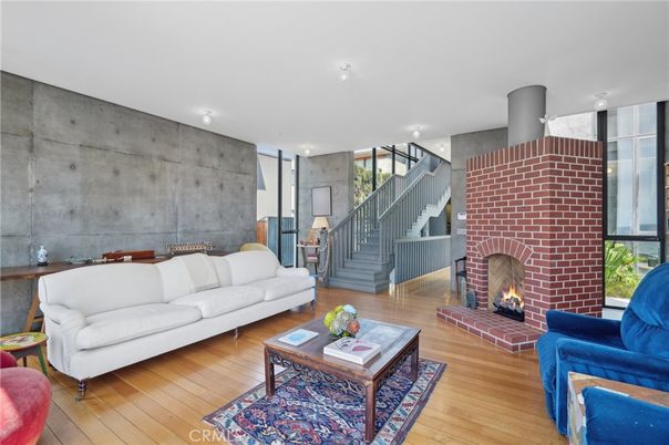Dining room, Fireplace, Interior, Living room, Recessed Lighting, Stone Walls, Wood Texture Flooring