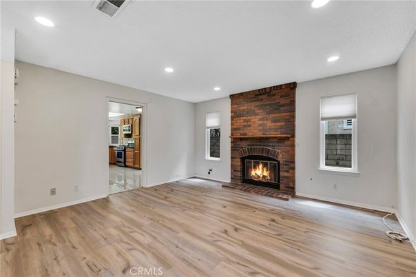 Empty room, Fireplace, Interior, Recessed Lighting, Stone Walls, Wood Texture Flooring