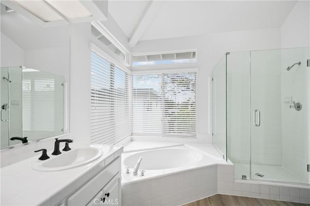 Bathroom, Dual Sink Vanities, Glass Shower, Interior, Tile Countertops, Wood Texture Flooring