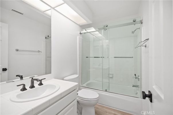 Bathroom, Glass Shower, Interior, Tile Countertops, Wood Texture Flooring