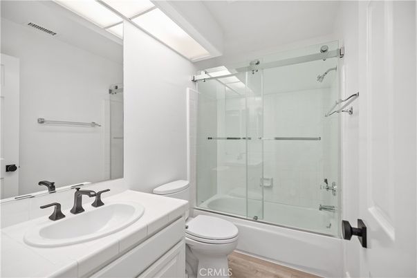Bathroom, Glass Shower, Interior, Tile Countertops, Wood Texture Flooring