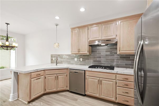 Chandelier, Interior, Kitchen, Pendant Lights, Recessed Lighting, Stainless Steel Appliances, Wood Texture Flooring