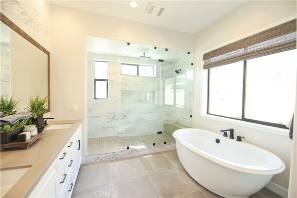 Bathroom, Dual Sink Vanities, Free Standing Baths, Glass Shower, Interior, Marble Walls, Recessed Lighting