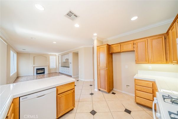 Fireplace, Interior, Kitchen, Recessed Lighting, Tile Countertops